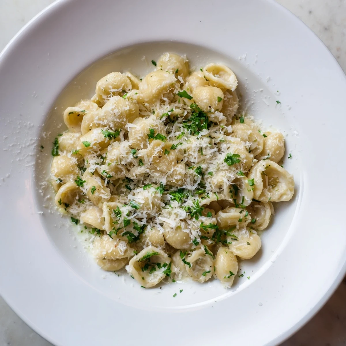 Steaming bowl of 15-Minute Garlic Parmesan Pasta, creamy and rich with fresh Parmesan cheese.