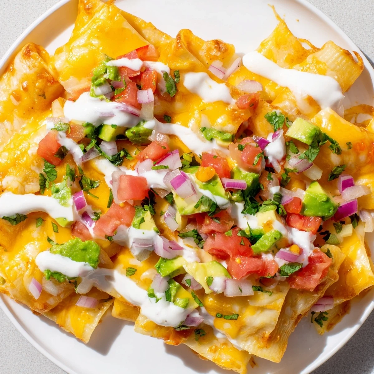 Cheesy pasta chips nachos with a creamy, zesty sauce: perfect for a flavorful snack to share.