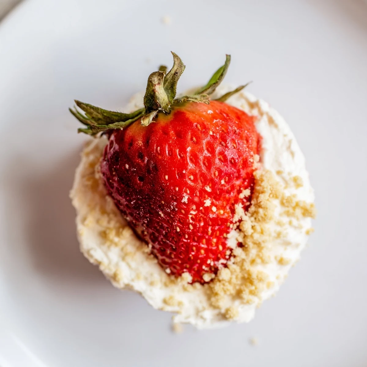 Fresh, red Cheesecake Stuffed Strawberries, bite-sized delights with creamy filling and graham cracker topping.