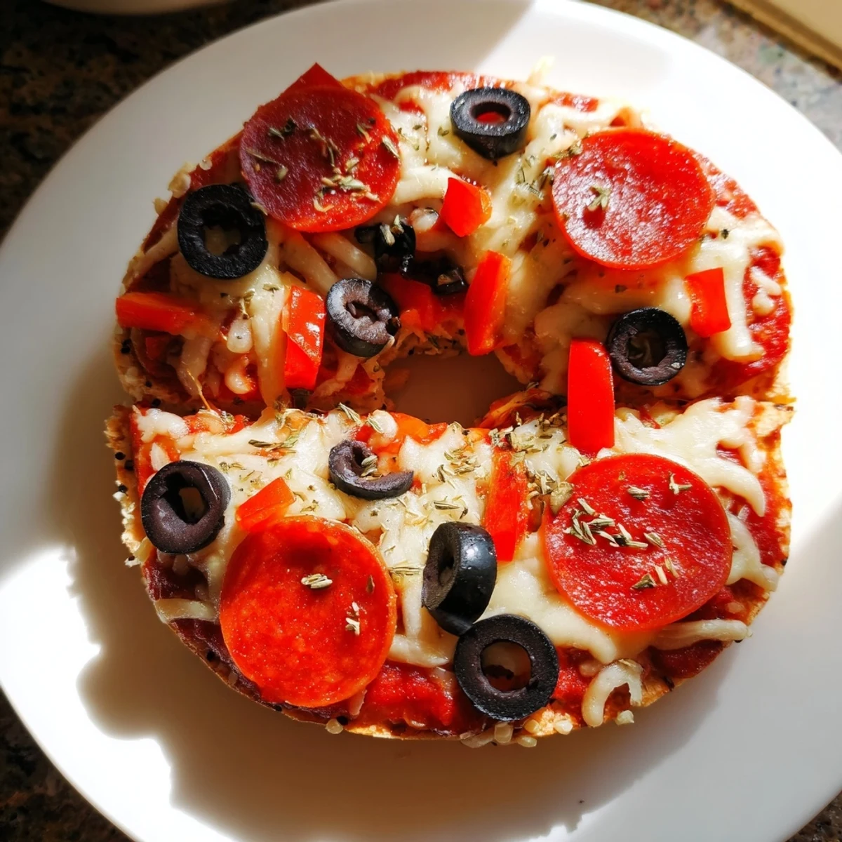 Warm, bubbly mozzarella melting on delicious mini bagel pizzas, perfect as a quick snack.