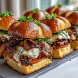 Kentucky Derby Hot Brown Sliders on Brioche Buns with roasted turkey, bacon, and creamy Mornay sauce in golden brioche slider buns.