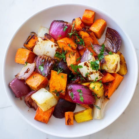 Golden-brown Roasted Root Vegetable Medley glistening with balsamic glaze, a flavorful side dish.