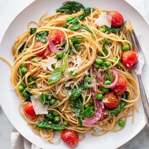 Topped with grated Parmesan and fresh basil, served steaming in a rustic bowl.