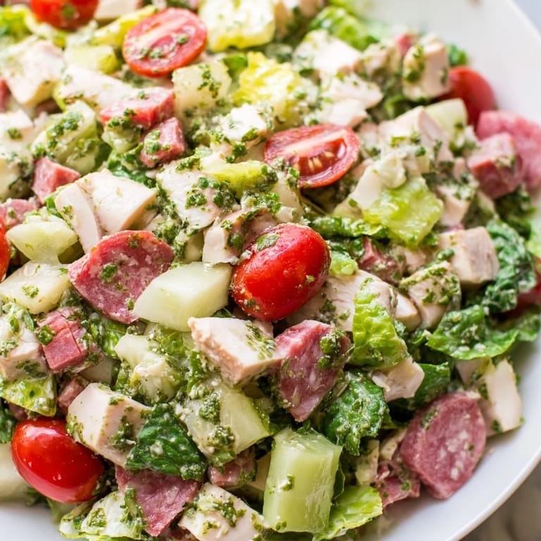 Hearty Italian Deli Chopped Chicken Salad served on chilled romaine with a light, zesty vinaigrette.