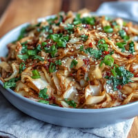 Spicy Cabbage Stir Fry with vibrant vegetables and chili, wok-tossed to crisp-tender perfection for a quick, flavorful side dish.  